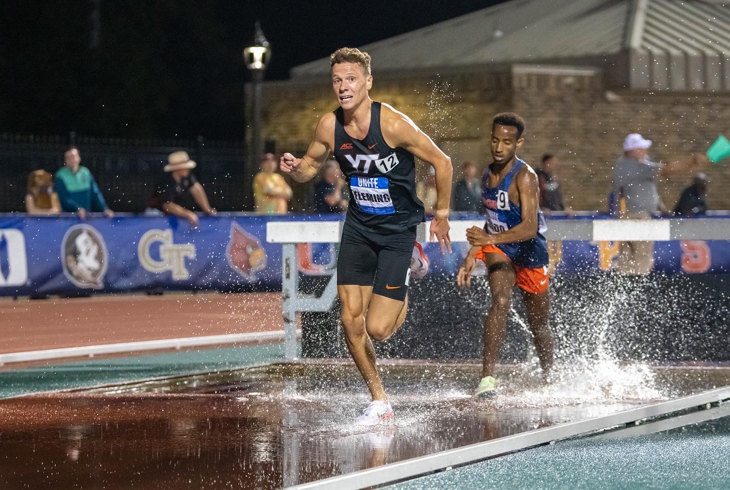 Ben Fleming clearing the steeplechase water jump for Virginia Tech